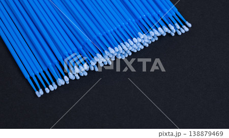 Close-up of blue disposable microbrush applicators for eyelash extension on black background 138879469
