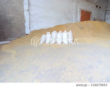 Heap of grains of barley and wheat in stock Heap of grains of barley and wheat in stock 138879663