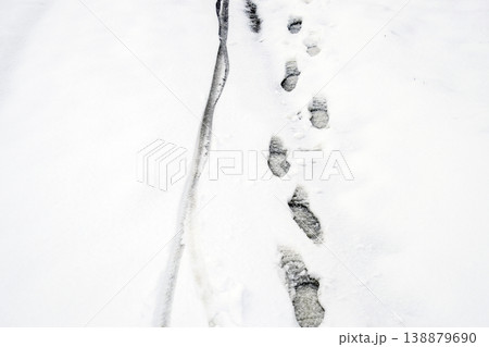 Human footprints in the snow. The path in the snow Human footprints in the snow. The path in the snow 138879690