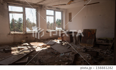 Sunlit Decaying Room With Broken Windows, Scattered Debris, Peeling Paint, Abandoned Furniture, Floorboards Sunlit Decaying Room With Broken Windows, Scattered Debris, Peeling Paint, Abandoned Furniture, Floorboards 138881282