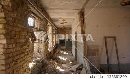 Sunlit Domestic Ruin With Leaning Plaster, Fractured Windows And Scattered Household Debris Intimate Interior Suggests Civilian Home Damaged By Conflict And Slow Process Of Documenting Loss Sunlit Domestic Ruin With Leaning Plaster, Fractured Windows And Scattered Household Debris Intimate Interior Suggests Civilian Home Damaged By Conflict And Slow Process Of Documenting Loss 138881299