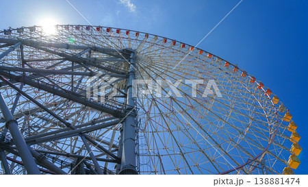 Osaka, Japan - Oct 11 2024, panoramic view from below of the Tempozan Ferris wheel against a blue sky, without people, in the daytime, Osaka, Japan Osaka, Japan - Oct 11 2024, panoramic view from below of the Tempozan Ferris wheel against a blue sky, without people, in the daytime, Osaka, Japan 138881474