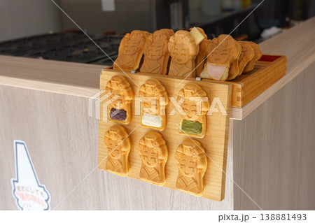 Kyoto, Japan - Oct 11 2025, A close-up view of a cafe counter with Taiyaki pies in the form of geisha with various fillings, without people, at daytime, Kyoto, Japan 138881493