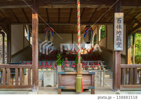 Kyoto, Japan - Oct 11 2025, Panoramic view of hall filled with stone statues of red scarves of god Jizo, the patron saint of small children, at Kiyomizu dera Temple, at daytime, Kyoto, Japan 138881518