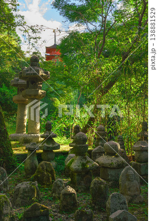 Kyoto, Japan - Oct 11 2024, panoramic view of cemetery with many moss-covered tombstones in form of stone pyramids or sculptures surrounded by trees on territory of Kiyomizu-dera Temple, Kyoto, Japan Kyoto, Japan - Oct 11 2024, panoramic view of cemetery with many moss-covered tombstones in form of stone pyramids or sculptures surrounded by trees on territory of Kiyomizu-dera Temple, Kyoto, Japan 138881529