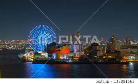 Osaka, Japan - Oct 11 2024, panoramic aerial view from the sea of the Osaka Port Cruise Terminal with a giant Tempozan Ferris Wheel with illumination, at nighttime, Osaka, Japan 138881563