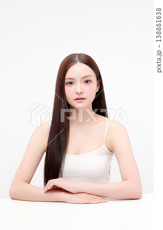 Portrait beautiful young Asian woman with K beauty style makeup and perfect skin on isolated white background. Facial and skin care concept for commercial advertising. Portrait beautiful young Asian woman with K beauty style makeup and perfect skin on isolated white background. Facial and skin care concept for commercial advertising. 138881638