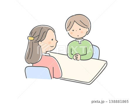 対面で話し合う子供と女性カウンセラー 138881865
