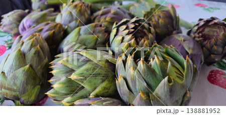 Close up view of Artichokes set up on table to be cooked Close up view of Artichokes set up on table to be cooked 138881952