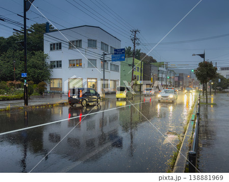 Muroran, Hokkaido, Japan - Oct 4 2024, panoramic view of cars with their headlights on driving on a wet road during the rain, without people, Muroran, Japan 138881969