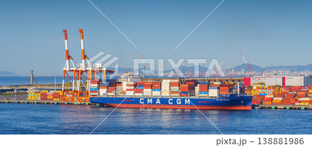 Osaka, Japan - Oct 11 2024, panoramic sea view of the docks of the Osaka Commercial Port with a heavily loaded CMA CGM cargo ship moored during the daytime, Osaka, Japan Osaka, Japan - Oct 11 2024, panoramic sea view of the docks of the Osaka Commercial Port with a heavily loaded CMA CGM cargo ship moored during the daytime, Osaka, Japan 138881986