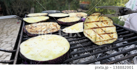 Close up view of Roasted eggplants on carbon barbecue Close up view of Roasted eggplants on carbon barbecue 138882001