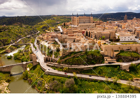 Drone view of Toledo on Tagus river with medieval Alcazar fortress 138884395