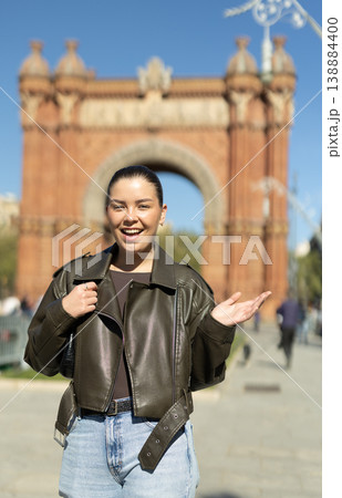 Portrait of girl in front of the Arc de Triomphe on sunny spring day. Barcelona, Spain Portrait of girl in front of the Arc de Triomphe on sunny spring day. Barcelona, Spain 138884400