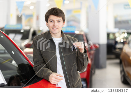Guy is joyful to buy a car, he keeps the keys in his hands 138884557