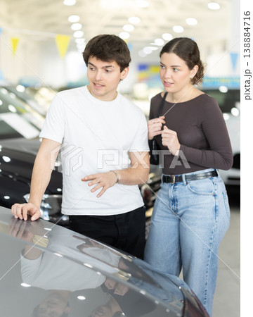 Young couple choosing car at auto dealership 138884716
