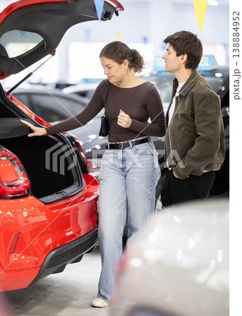 Young couple choosing car at auto dealership 138884952