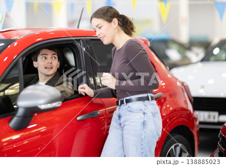 Young couple choosing car at auto dealership 138885023