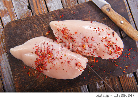 chicken breast with spice on wooden board chicken breast with spice on wooden board 138886847