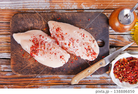 chicken breast with spice on wooden board 138886850
