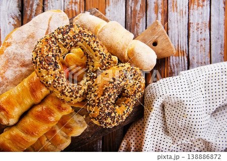 close-up of round rich light buns with seeds freshly prepared bakery white bread carbohydrate diet sprinkled with white and black sesame seeds close-up of round rich light buns with seeds freshly prepared bakery white bread carbohydrate diet sprinkled with white and black sesame seeds 138886872