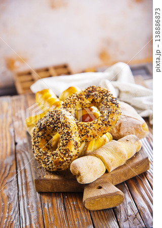 close-up of round rich light buns with seeds freshly prepared bakery white bread carbohydrate diet sprinkled with white and black sesame seeds close-up of round rich light buns with seeds freshly prepared bakery white bread carbohydrate diet sprinkled with white and black sesame seeds 138886873