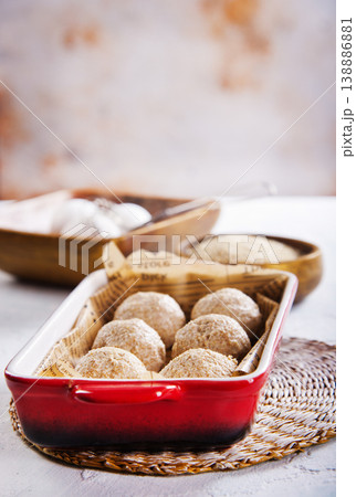 Rounded bread dough balls prepared for baking Rounded bread dough balls prepared for baking 138886881