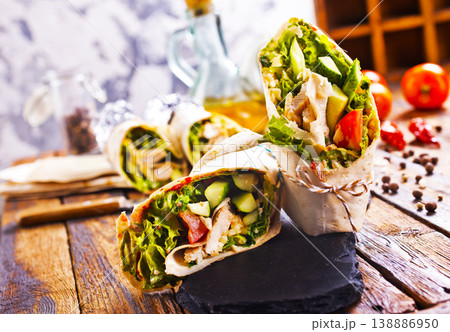 Tortilla wraps with chicken fillet and vegetables. 138886950
