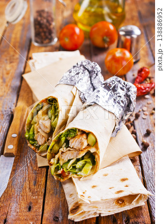 Tortilla wraps with chicken fillet and vegetables. 138886952