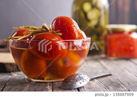 Assortie Jars of Marinated vegetables picles tomato on a wooden background Assortie Jars of Marinated vegetables picles tomato on a wooden background 138887009