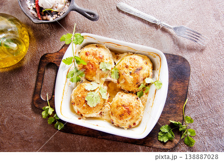 baked chicken cutlets in white bowl 138887028