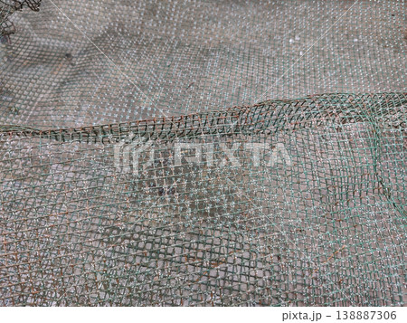 Construction mesh net with water droplets texture showing reinforcement material background Construction mesh net with water droplets texture showing reinforcement material background 138887306