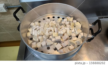 Diced Fresh Taro Root Chunks in a Large Aluminum Steamer Pot 138888202