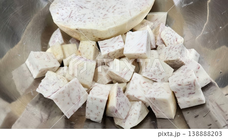 Fresh Raw Diced Taro Root Cubes and Slices in Stainless Steel Bowl 138888203