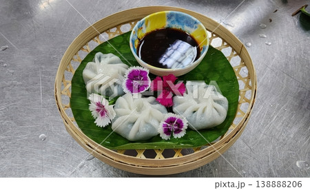 Steamed Thai Chive Dumplings with Soy Dipping Sauce in Bamboo Basket Steamed Thai Chive Dumplings with Soy Dipping Sauce in Bamboo Basket 138888206