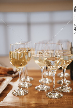 Elegant White Wine Glasses Arranged for a Formal Gathering Elegant White Wine Glasses Arranged for a Formal Gathering 138888826