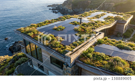 Solar green roof modern seaside home overlooking cliffs integrates renewable energy and sustainable architecture 138889005