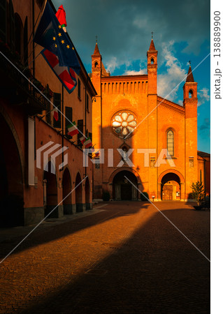 San Lorenzo cathedral illuminated by evening sun in Alba, Italy. 138889900