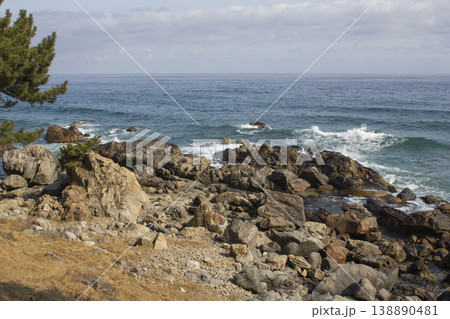 It's a seaside scenery with rocks. 138890481