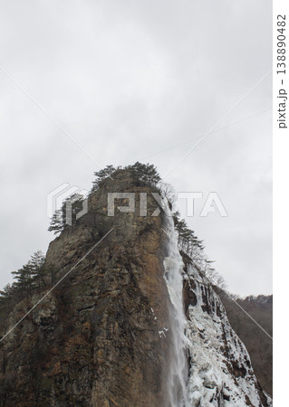 It's a cliff with a waterfall. It's a cliff with a waterfall. 138890482