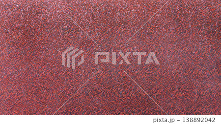 細かな楕円のでこぼこが密集する赤褐色のテクスチャ 138892042