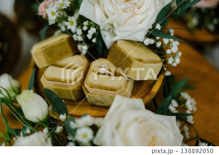 Diamond Wedding Rings in Gold Velvet Hexagon Box with White Roses Diamond Wedding Rings in Gold Velvet Hexagon Box with White Roses 138892050