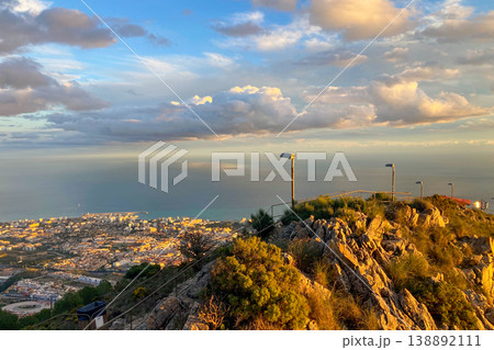 Warm sunset light illuminates Fuengirola city and coastline, viewed from South Viewpoint on Mount Calamorro. Warm sunset light illuminates Fuengirola city and coastline, viewed from South Viewpoint on Mount Calamorro. 138892111