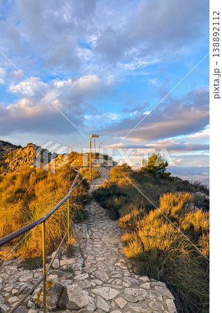 Warm sunset light illuminates Fuengirola city and coastline, viewed from South Viewpoint on Mount Calamorro. Warm sunset light illuminates Fuengirola city and coastline, viewed from South Viewpoint on Mount Calamorro. 138892112