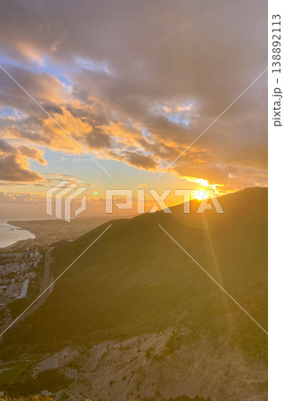 Warm sunset light illuminates Fuengirola city and coastline, viewed from South Viewpoint on Mount Calamorro. 138892113