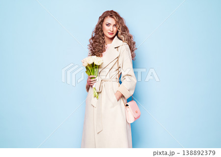 Young woman in white spring coat Young woman in white spring coat 138892379