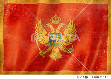 Old vintage flag of Montenegro, worn and stained 138893612