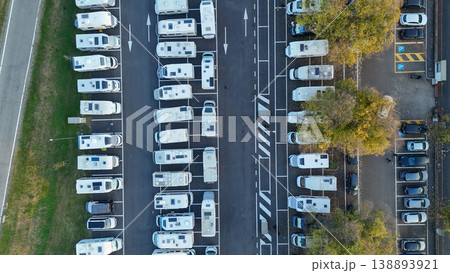 Aerial view of recreational vehicles parked in rows at Piazzale Azzuri d'Italia parking lot, Cremona, Italy 138893921