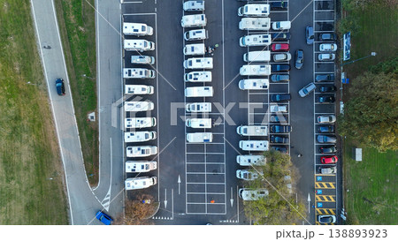 Aerial view of recreational vehicles parked in rows at Piazzale Azzuri d'Italia parking lot, Cremona, Italy 138893923