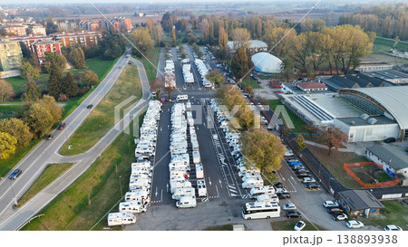 Aerial view highlighting numerous RVs and campers parked at the dedicated facility in Piazzale Azzurri d'Italia, Cremona 138893938
